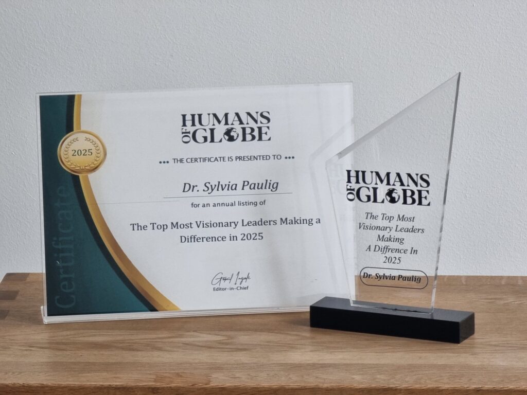 Eine Auszeichnung und ein Zertifikat an Dr. Sylvia Paulig von "Humans of Globe" für 2025.